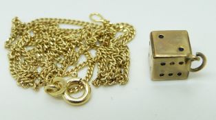 A 9ct gold necklace and a yellow metal dice charm/ pendant marked 333, 4.1g