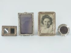 Three hallmarked silver photograph frames, the largest 18 x 13cm overall to take a 6 x 4 photo,