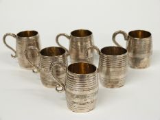 A 19thC set of six Italian white metal novelty tankards with gilt interiors, various marks 1832-