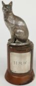 A hallmarked silver cat with glass eyes, London 1965 maker William Comyns & Sons Ltd, height of
