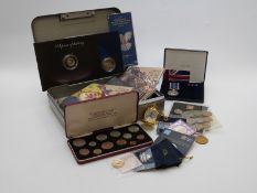 A collection of largely Royal Mint commemorative coins in presentation packs, includes Coronation