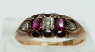 An 18ct gold ring set with diamonds and rubies, size K.