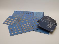 Nine Whitman folders containing Great Britain threepences, sixpences, shillings, florins and