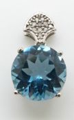 A 9ct white gold pendant set with a large blue topaz and diamonds, 2.4g