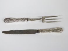 Continental white metal handled carving knife and fork, the floral embossed handles marked 800