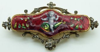 Victorian brooch set with red guilloché enamel depicting a cherub or putti, with rose cut diamonds