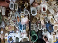 A collection of shoe ornaments including pair carved pin cushions, possibly trench art dated 1914-