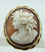 A 9ct gold ring set with a shell cameo depicting a lady, size I