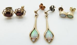 A pair of 9ct gold earrings set with opals and cubic zirconia, a pair of 9ct gold earrings set