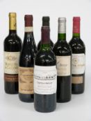Six bottles of red wine including Chateau Angaut 1996, Carta Roja Monastrell 2001, Castillo de