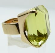 A 9ct gold ring set with a large emerald cut prasiolite, Sheffield 1975, maker J.S, size H