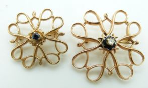 A 9ct gold brooch set with a diamond and a similar smaller example set with a sapphire, 5.4g