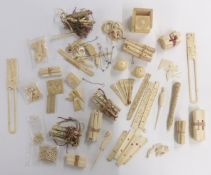 A collection of mostly Chinese 19thC carved ivory pieces, puzzles pieces, fan parts, panels etc