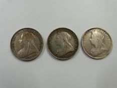 Three veiled head Victorian crowns, two for 1893 and an 1897 example