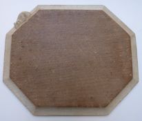Robert 'Mouseman' Thompson octagonal oak bread board with bevelled edge and signature carved