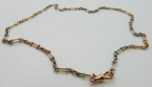 An 18ct gold bi-colored fob chain/ necklace made up of elongated links and knot designs, 18.79g