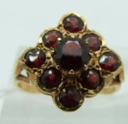 A 9ct gold ring set with garnets, size K