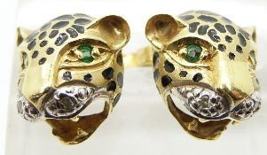 A pair of 18ct gold earrings in the form of leopards, set with emerald eyes, enamel and diamonds