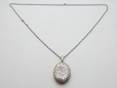 Victorian white metal locket with engraved ivy decoration and chain