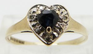 A 9ct gold ring set with a sapphire and diamonds in a heart shape, size O