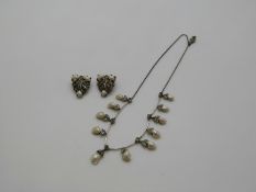 A necklace set with marcasite and blister pearls together with matching clips