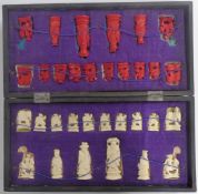 A 1920's Chinese carved bone chess set in original fitted lacquer box, height of king 7.5cm