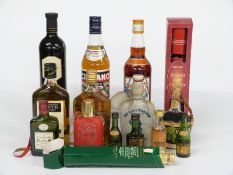 A collection of alcohol including a Pimm's 70 cl 25% vol, Cinzano 75cl 14.7% vol, Black Tower