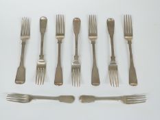 Nine Georgian fiddle pattern hallmarked silver forks comprising a set of six table forks, London