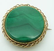 Yellow metal brooch set with malachite