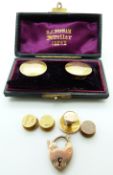 A pair of hallmarked 15t gold studs/ buttons in original box, four further 15ct gold studs, one by