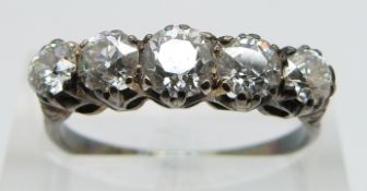 An 18ct gold ring set with five diamonds in a platinum setting, the diamonds approximately 0.5ct,