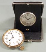 Travel alarm c1920s together with a similar 8 day Goliath style clock