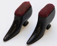 Pair of Victorian/Edwardian ebonised treen pin cushions in the form of ladies shoes, 5cm.