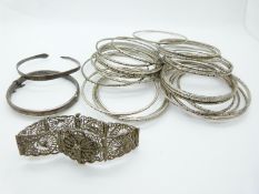 A hallmarked silver bangle, 29 Sudanese white metal bangles and a filigree bracelet