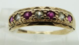 A 9ct gold ring set with rubies, size O