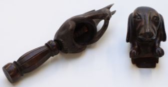 Black Forest carved squirrel nutcracker and a carved Dachshund wall mask, longest 20cm.