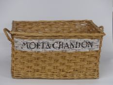 Large wicker basket named to side Moet & Chandon, length 77cm