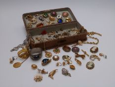 A collection of costume jewellery including brooches, rings, bangles, Jewelcraft necklace, white