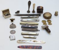 A collection of hallmarked silver and other fruit and pen knives, intaglio seals, pens, pencils,