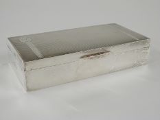 Elizabeth II hallmarked silver cigarette box with engine turned lid, Birmingham 1955 maker William