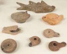 A quantity of ancient oil lamps including one example formed as a fish