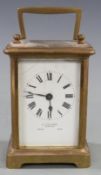 Late 19th/early 20thC French brass carriage clock by Allen and Daws, Norwich, the white enamel Roman