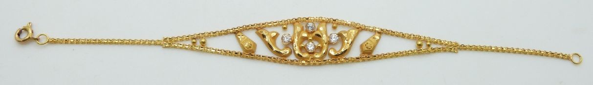 A yellow metal Eastern bracelet set with cubic zirconia, 4.7g