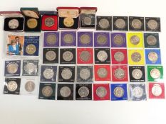 A quantity of cased Royal commemorative crowns including Gibraltar, Festival of Britain, Churchill