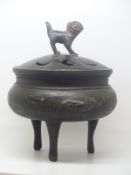 A bronze tripod censer / koro decorated with birds among bamboo friezes and with Dog of Fo finial,