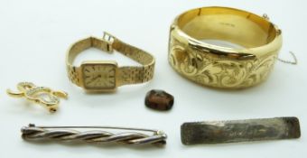 A rolled gold bangle, two silver brooches, Rotary watch and a brooch