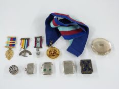 Three hallmarked silver vesta cases including one with enamel decoration, Masonic and similar
