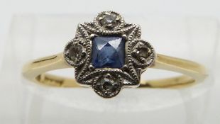 An 18ct gold ring set with a square cut sapphire and diamonds in a platinum setting, size K