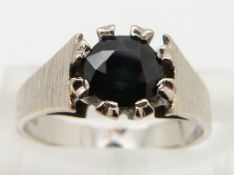 An 18ct white gold ring set with a sapphire, size I