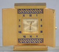 Mappin & Webb miniature gilt travel clock with doors opening to reveal a square face surrounded by